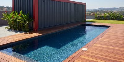A modern shipping container transformed into a leisure swimming pool with decking by IDEAL Containers in Kenya