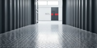 Close-up of newly installed corrugated Steel Container Flooring inside a shipping container, showing its robust and durable s
